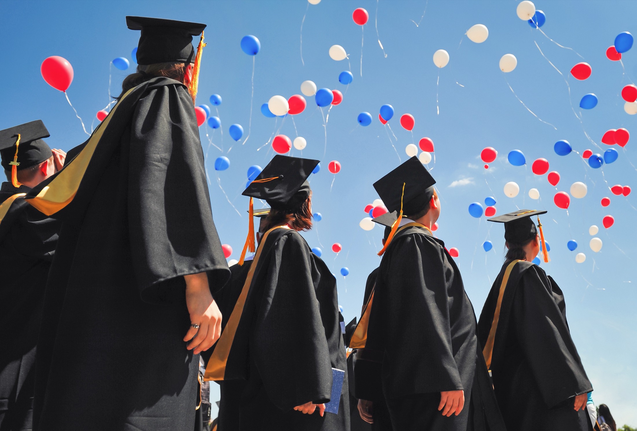 Graduates celebrating at a university commencement