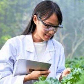 Scientist reviewing field notes on a tablet