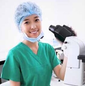 Nurse at a microscope