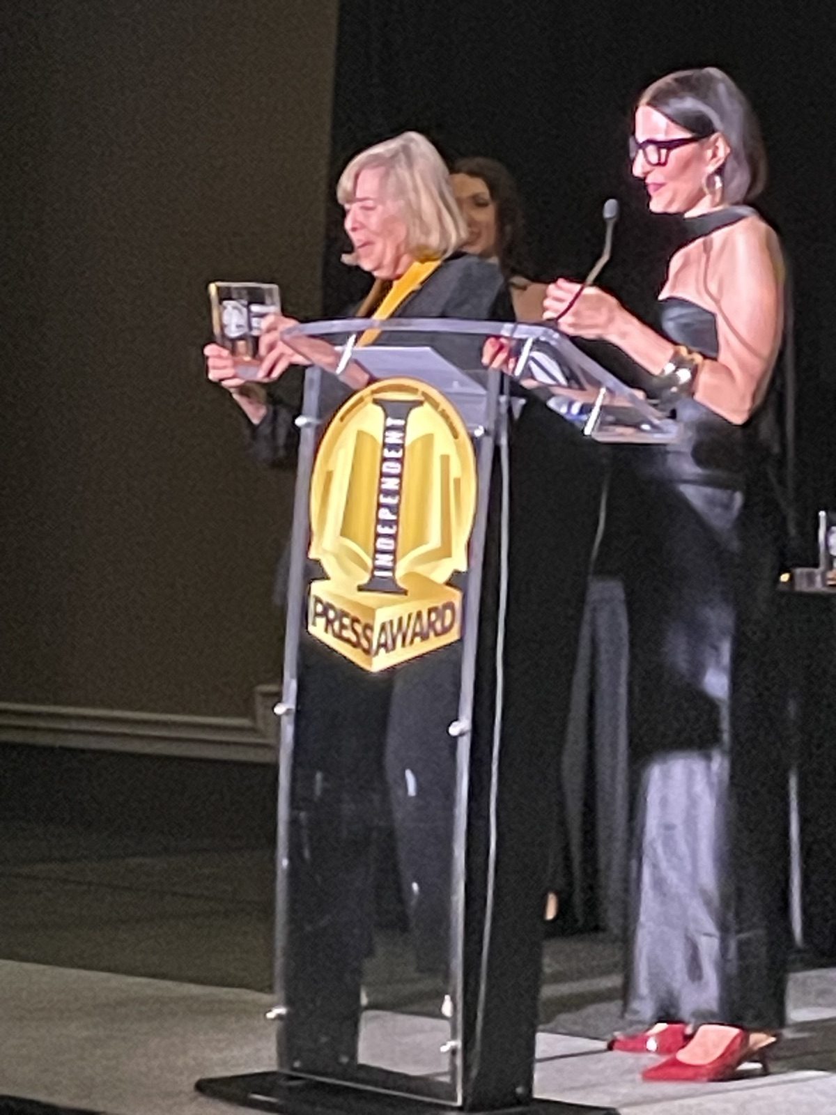Kathryn Troutman accepting the 2026 Independent Press Award on stage