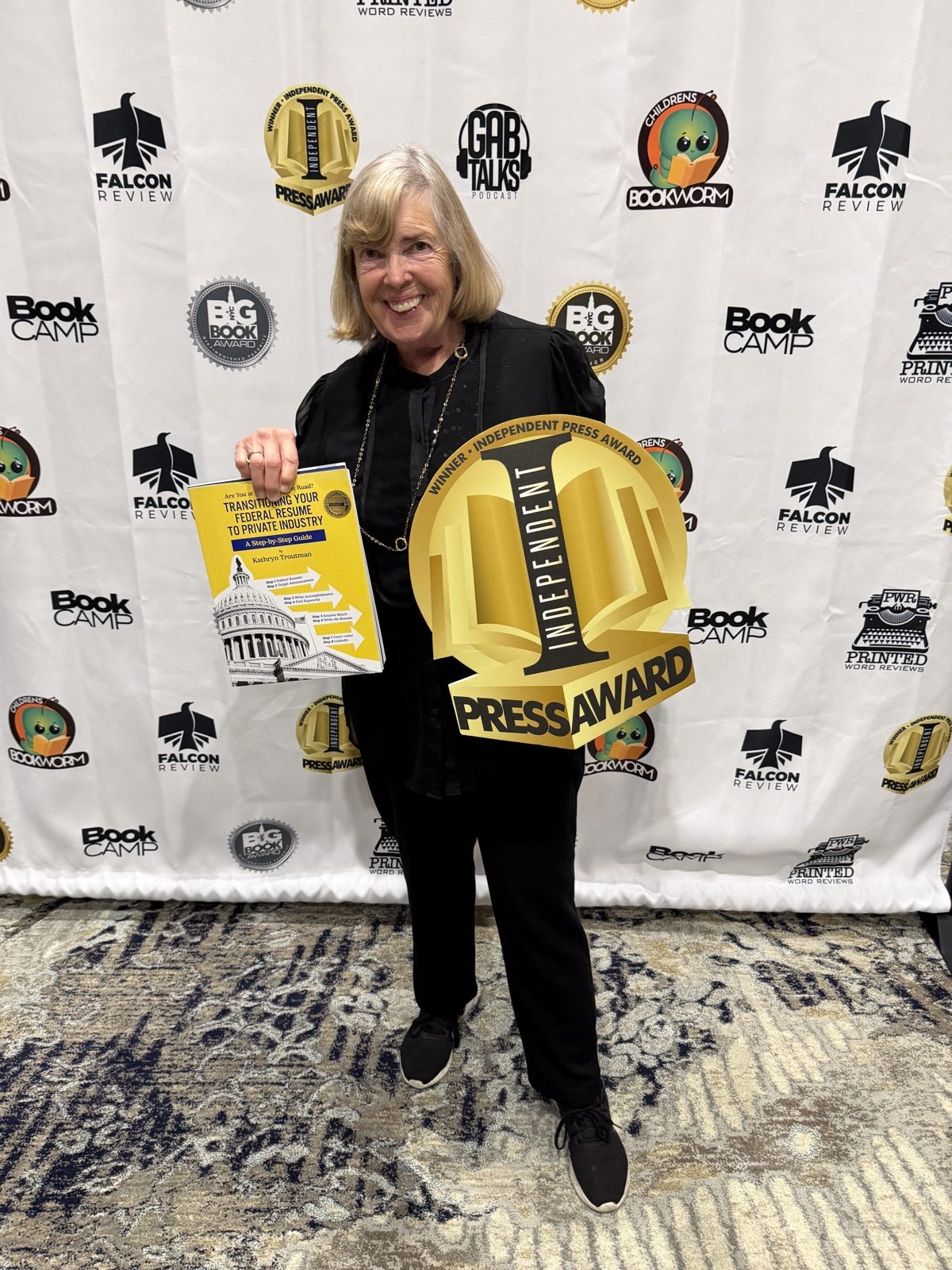 Kathryn Troutman with the 2026 Independent Press Award Winner seal and Transitioning Your Federal Resume to Private Industry